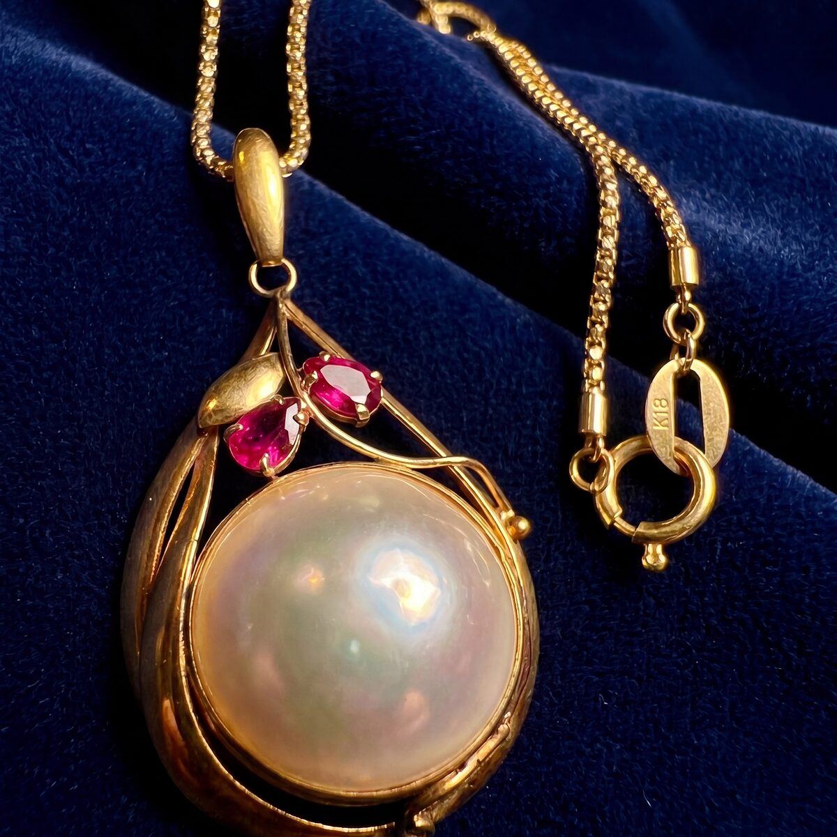 Mabe Pearl And Ruby Drop Pendant — photograph 1